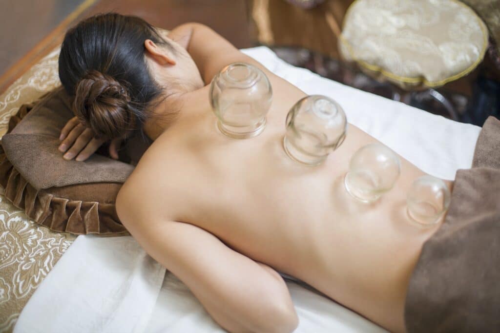 Young woman receiving vacuum cupping treatment
