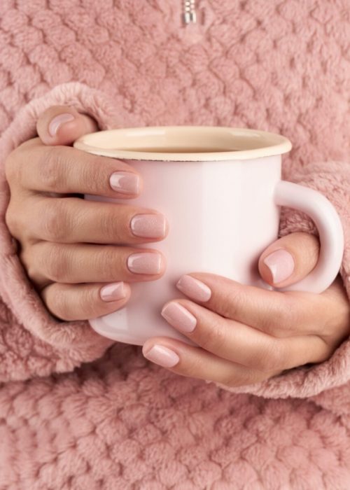 hands holding cup of tea